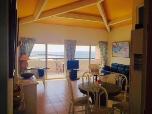 a living room with a view of the ocean at Savanna Beach in Cap d'Agde