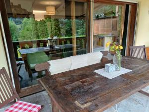 a wooden table in a room with a dining room at Haus Miele in Garmisch-Partenkirchen
