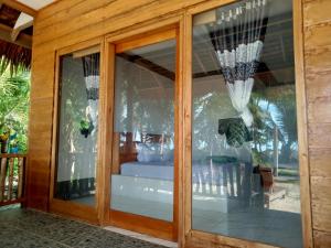 Ένα ή περισσότερα κρεβάτια σε δωμάτιο στο Bintang Left Homestay Mentawai
