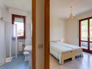Ένα ή περισσότερα κρεβάτια σε δωμάτιο στο Elegant apartment on Lake Trasimeno