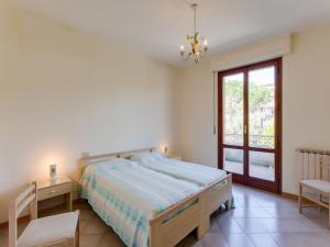 Ένα ή περισσότερα κρεβάτια σε δωμάτιο στο Elegant apartment on Lake Trasimeno