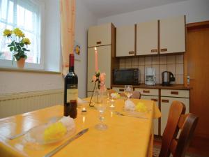 a bottle of wine sitting on top of a table at Ferienhaus in der Nähe der Skipiste in Stadlern