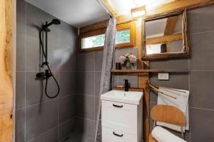 a small bathroom with a shower and a toilet at Natural Riverside Retreat In Tiglieto in Tiglieto