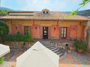 a house with a white tent in front of it at Spacious Mansion in Parghelia near Sea in Parghelia +33 photos