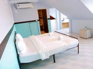 a hospital bed in a room with a staircase at Mitr Inn Phuket Oldtown in Phuket Town +30 photos