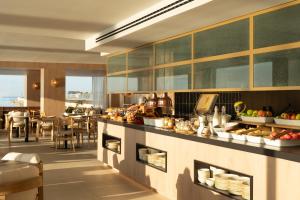 a kitchen with a counter with food on it at INNSiDE by Meliá Alicante Porta Maris in Alicante