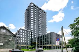 two tall buildings on a city street with a sky at Luxury apartment, outstanding view, free parking in Tallinn