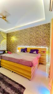 Postel nebo postele na pokoji v ubytování Sk Golden Studio Apartment