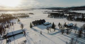 an aerial view of a house in the snow at Historic Hunting Lodge By Lake Øyangen in Hønefoss