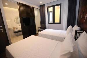 Ένα ή περισσότερα κρεβάτια σε δωμάτιο στο Wyndham Lyntimes Thanh Thuỷ Shoptel - Khoáng nóng Onsen +19 φωτογραφίες