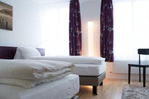 Voodi või voodid majutusasutuse Gasthof zum Mohren toas