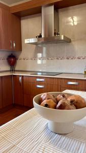 a bowl filled with pigs in a kitchen at Casa Rural Alcubillas in Las Alcubillas Altas