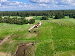 an aerial view of a farm house in a field at Suwalskie Klimaty in Kaletnik