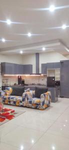 a room with couches on the floor in a building at Rumah in Sukabumi