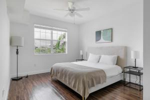 Ένα ή περισσότερα κρεβάτια σε δωμάτιο στο Blueground Miramar pool nr CB Smith Park MIA-156 +32 φωτογραφίες