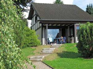 a person sitting at a table in a house at Holiday home in Mielinghausen near ski area in Reiste