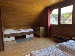 Ένα ή περισσότερα κρεβάτια σε δωμάτιο στο Blockhaus, Bad Sachsa