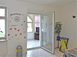 a room with a door with butterflies on the wall at Ferienwohnung in Ballenstedt in Ballenstedt