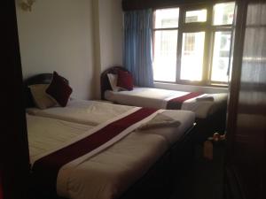 Postel nebo postele na pokoji v ubytování Hotel Lily