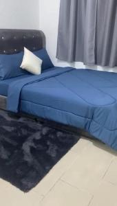 Ένα ή περισσότερα κρεβάτια σε δωμάτιο στο SR Sireh Residence