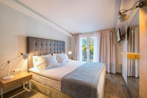 Postel nebo postele na pokoji v ubytování Albatros Hotel