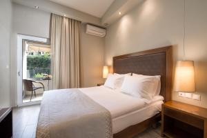 Postel nebo postele na pokoji v ubytování Albatros Hotel