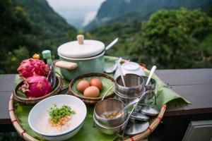 a tray with food and eggs on a table at ม่านหมอก ผาฮี้ in Ban Ko Doi Tung