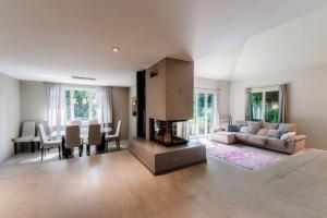 a living room with a couch and a fireplace at Villa Marta by Quokka 360 - 15 minutes from the centre of Como in San Fermo della Battaglia +45 photos