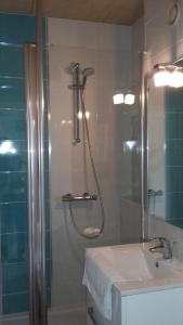 a bathroom with a shower and a sink and a shower at Hotel De La Mer in Saint Malo +28 photos