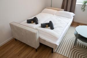 Ένα ή περισσότερα κρεβάτια σε δωμάτιο στο Sailor's Cabin - Neues Apartment in Deichnähe mit Garage von STAY YOUR WAY