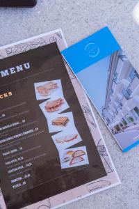 a menu sitting on top of a table at Hotel Laura in Cavallino-Treporti +136 photos