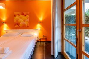 a bedroom with two beds and a window at Tenuta Madonnina in Castiglione di Sicilia +36 photos