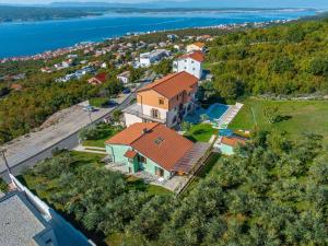 an aerial view of a house with a pool at Apartments in Crikvenica 43070 in Barci