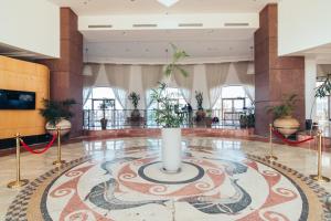 a lobby with a large rug on the floor with a candle at Luxury Suite with Jacuzzi on the beach by Almog Beach Haifa in Haifa