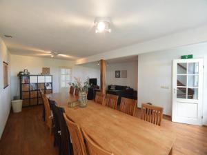 a dining room and living room with a table and chairs at Farmhouse in Elsendorp near Forest Trails in Elsendorp +31 photos