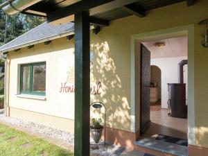a side view of a house with the door open at Cozy Escape in Walthersdorf in Scheibenberg +32 photos