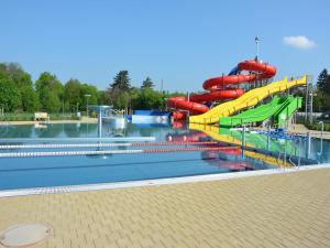 a water park with a water slide in it at Mountain Retreat with Pool in Hnanice