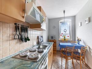 a kitchen with a sink and a counter top at idyllische Ferienwohnung in Lichtenhain in Lichtenhain +32 photos