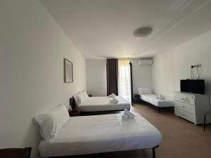 Ένα ή περισσότερα κρεβάτια σε δωμάτιο στο Marina View Apartments