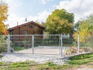 a gate in front of a house at Charmantes Ferienhaus mit eigenem Garten in Niederaula +32 photos