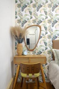 a dressing table with a mirror on a wall at Upscale 2BR Home in New York