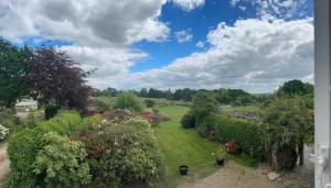 a view of a garden with bushes and trees at Detach Sandstone Cottage, Sleeps 6, 2 x King Size, 2 x Singles in Lower Beeding