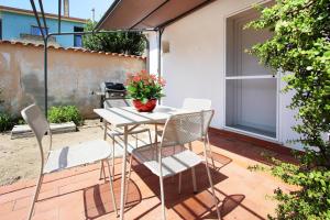 a table and chairs sitting on a patio at Villa Sa Marchesa in Solanas +56 photos