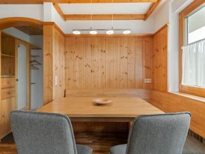 a dining room with a wooden table and chairs at Ferienwohnung, Bernau in Bernau im Schwarzwald