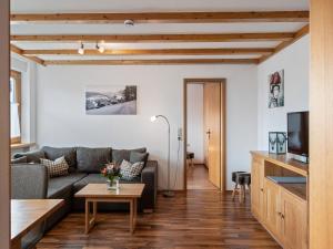 a living room with a couch and a table at Ferienwohnung, Bernau in Bernau im Schwarzwald