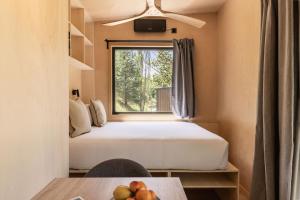 En eller flere senge i et værelse på Basecamps Cerdanya