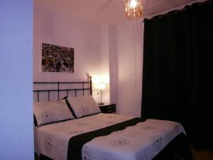 Postel nebo postele na pokoji v ubytování Hostal Don Pepe