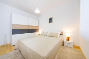 Posteľ alebo postele v izbe v ubytovaní Apartment Lavander