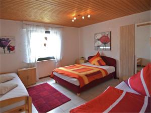 a bedroom with a bed and a window at Wohnung in Silbecke mit Pool und Wald in Attendorn