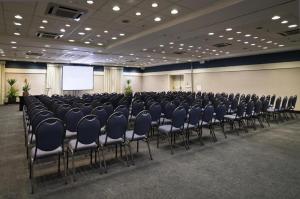 a conference room with a bunch of chairs in it at H714- Congonhas Hotel Flat in São Paulo +8 photos